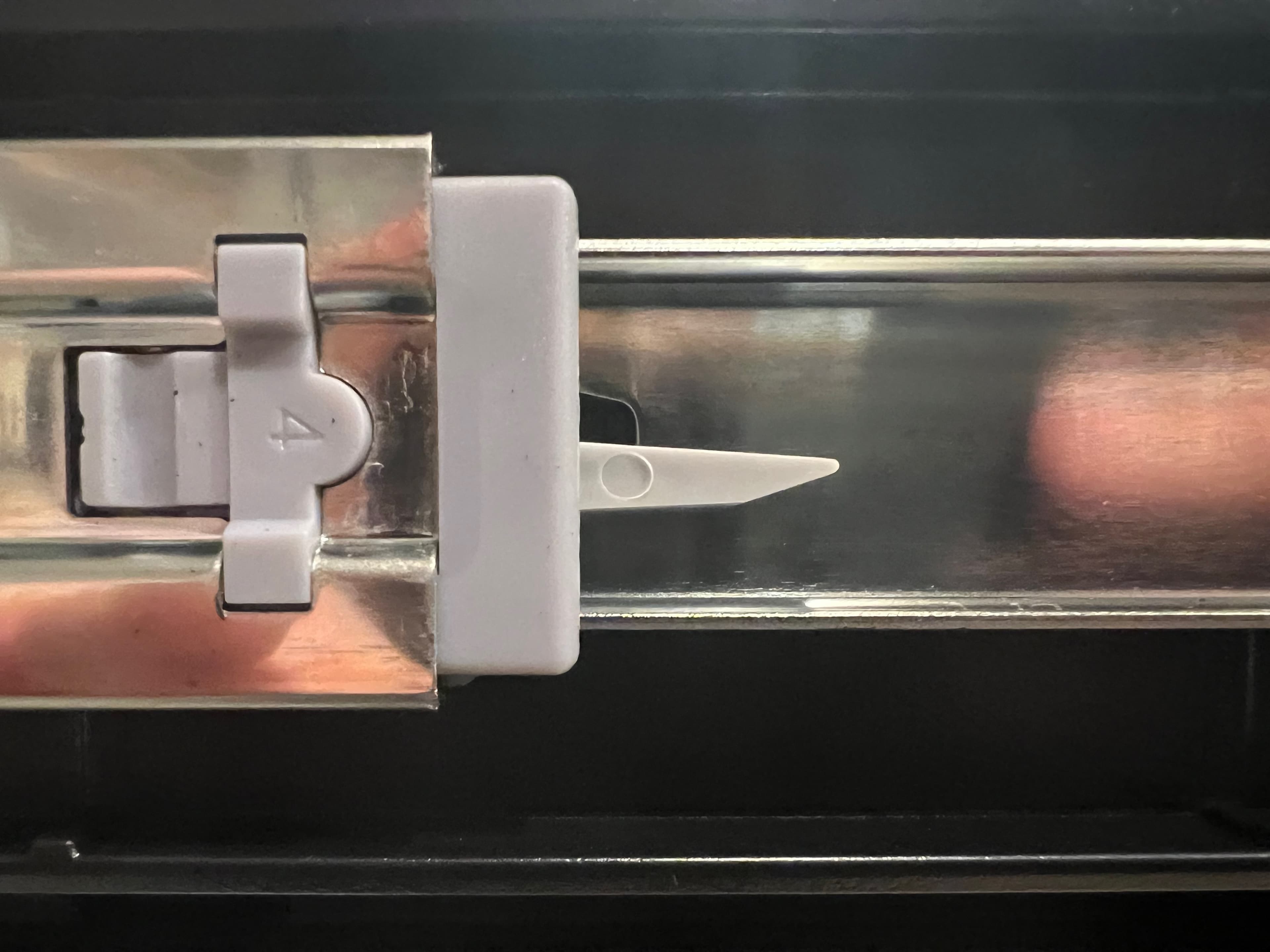 Drawer slide release latch used to extend or remove a case drawer