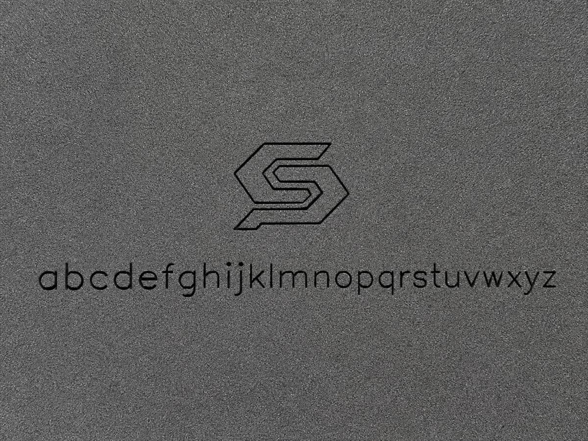 Laser-engraved logo and lowercase alphabet on charcoal foam