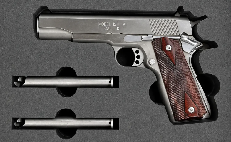 A foam insert with finger notches beside a pistol and its smaller parts